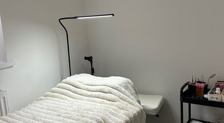 Relaxing treatment room at Defined By Freya, Attleborough, England, GB with a comfy bed and tools.