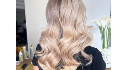 Elegant blonde waves styled at Isabelle Grace Hair, Burnley, England, GB.