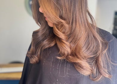 Elegant brown waves styled at Isabelle Grace Hair, Burnley, England, GB.