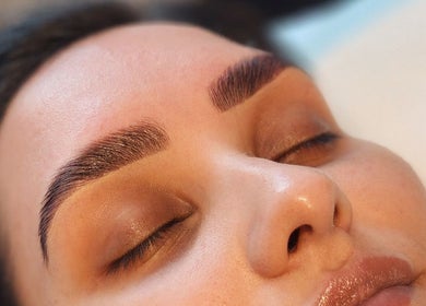 Close-up of a serene face with styled brows at Aurèla Beauty, Austral, New South Wales, AU.