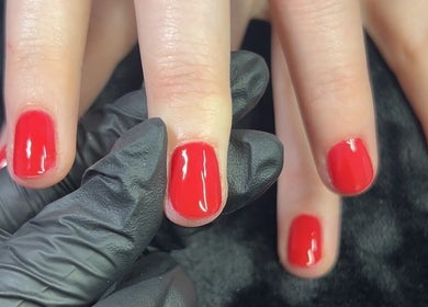 Bright red manicure showcased at Beauty By Yas, Attleborough, England, GB, exemplifying professional nail care.