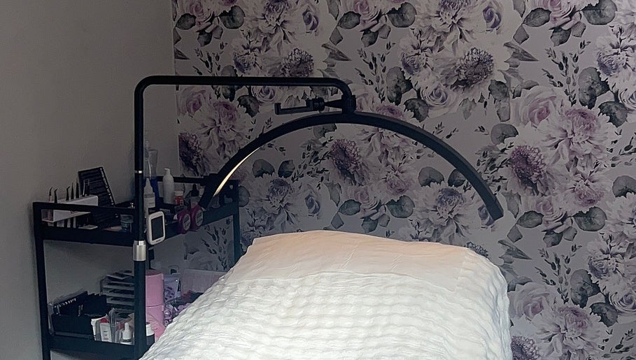 Beauty By Yas treatment room with floral wallpaper in Attleborough, England, GB, featuring a cozy aesthetic.