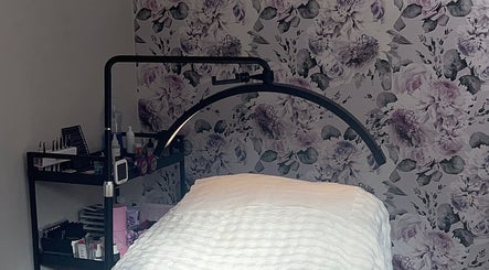 Beauty By Yas treatment room with floral wallpaper in Attleborough, England, GB, featuring a cozy aesthetic.