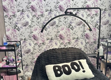 Relaxing treatment area at Beauty By Yas in Attleborough, England, GB, with floral décor and cozy ambiance.