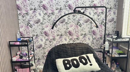 Relaxing treatment area at Beauty By Yas in Attleborough, England, GB, with floral décor and cozy ambiance.