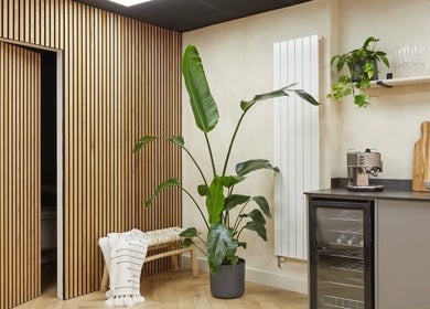 Relaxing space at Kenna Wellness & Spa in London, England, GB with plant and wooden decor.