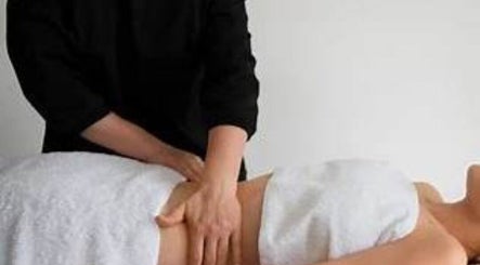 Massage session at Incension Body & Massage, Alderley, Queensland, AU, highlighting relaxation and wellness.