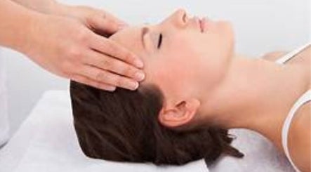 Calming head massage at Incension Body & Massage in Alderley, Queensland, AU promoting relaxation and wellness.