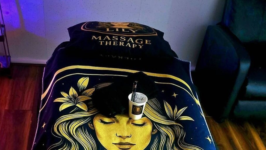 Massage table at Lily Massage Therapy, Glasgow, Scotland, GB, with calming decor.