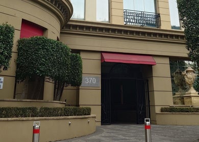 Entrance of Balancing Wellness, Melbourne, Victoria, AU with stylish architectural design and lush greenery.