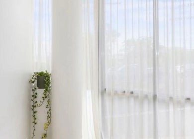 Bright, serene corner at Haus of Contouring - Shellharbour Clinic, with white curtains in Shellharbour City Centre.