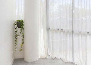 Elegant corner with sheer curtains at Haus of Contouring - Shellharbour Clinic, Shellharbour City Centre, NSW, AU.