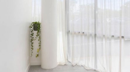 Elegant corner with sheer curtains at Haus of Contouring - Shellharbour Clinic, Shellharbour City Centre, NSW, AU.