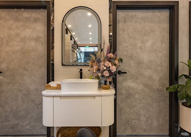 Elegant vanity at Eastland Natural Nails & Beauty in Melbourne, Victoria, AU. Modern decor with floral accents.