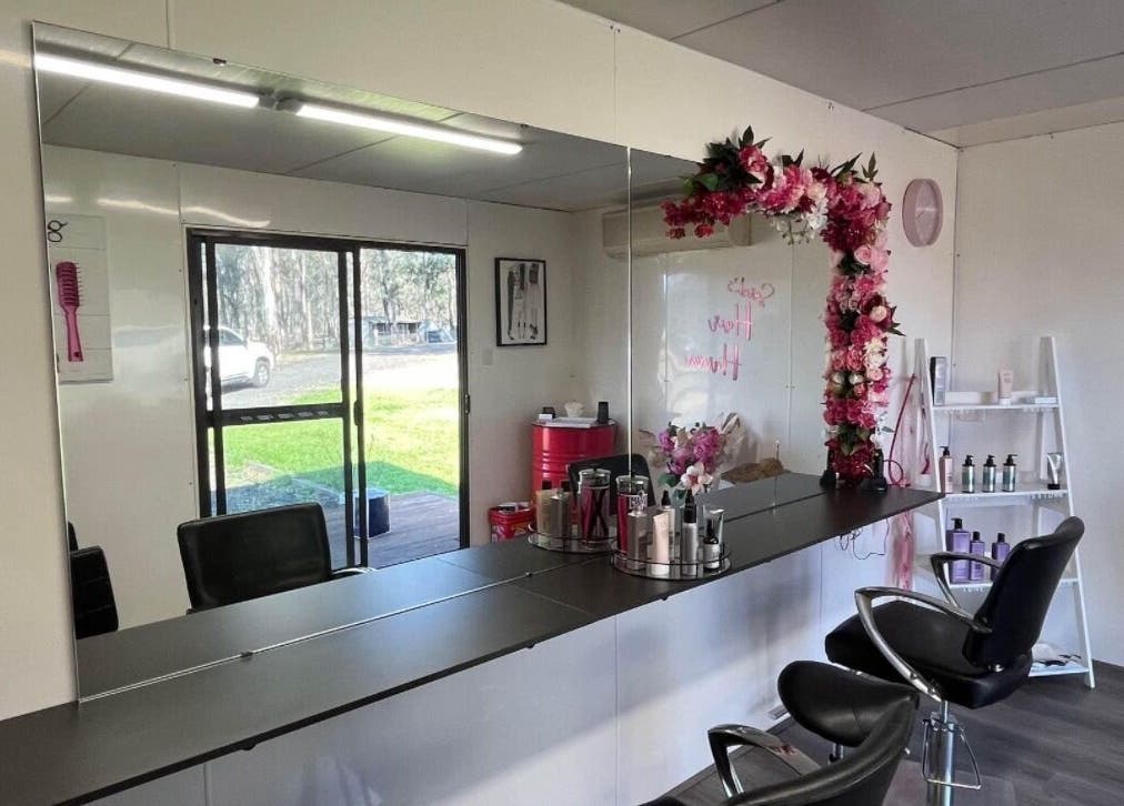 Interior of Shac Studio in Forbes, New South Wales, AU featuring floral decor and salon chairs.