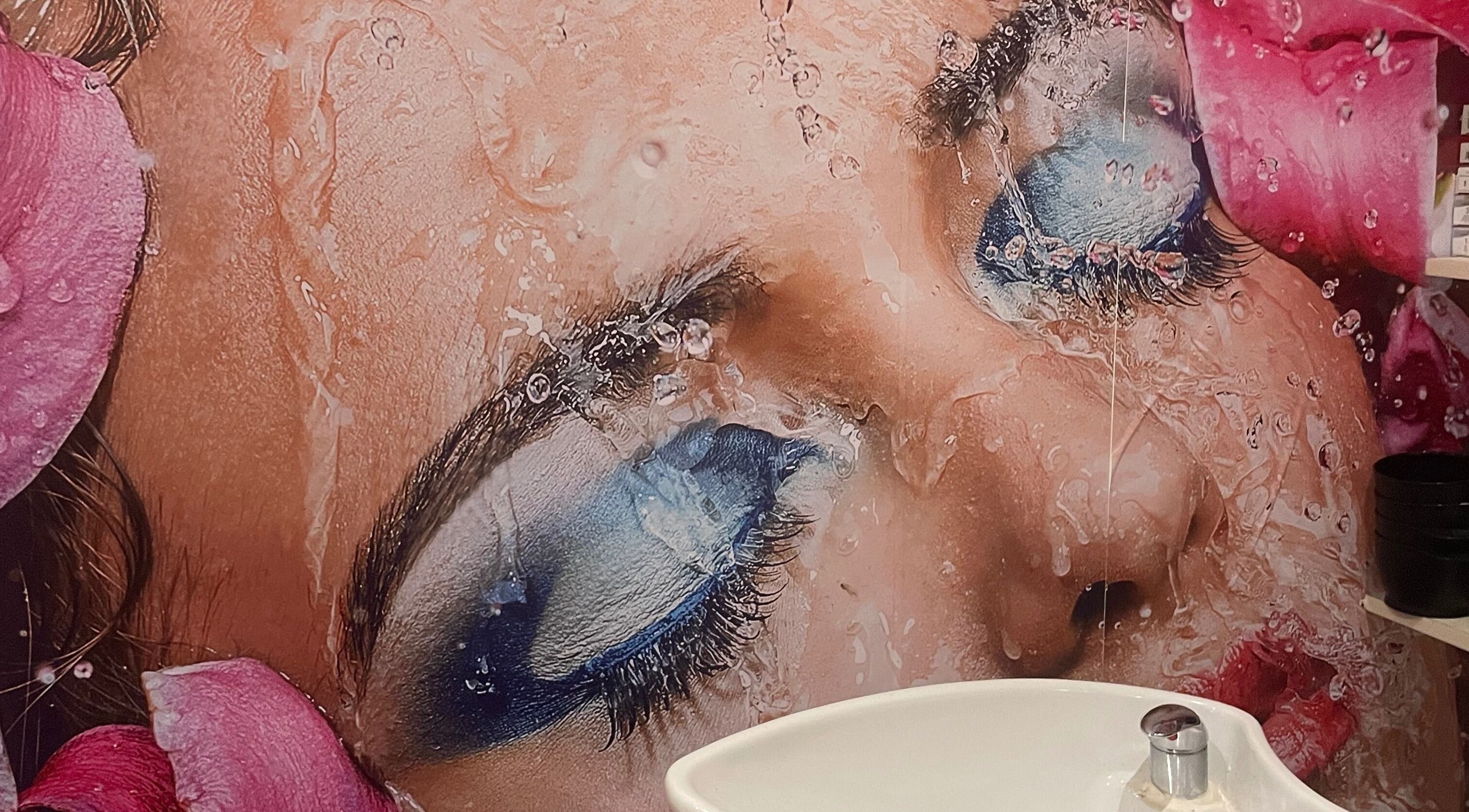 Elegant beauty mural at Sophie Michelle Hair in London, England, GB with a sink in the foreground.