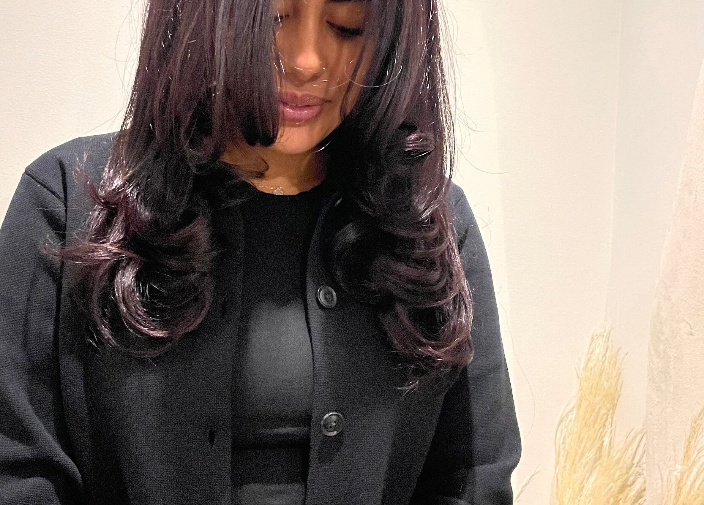 Woman with styled hair at Sophie Michelle Hair, London, England, GB, showcasing elegant curls.