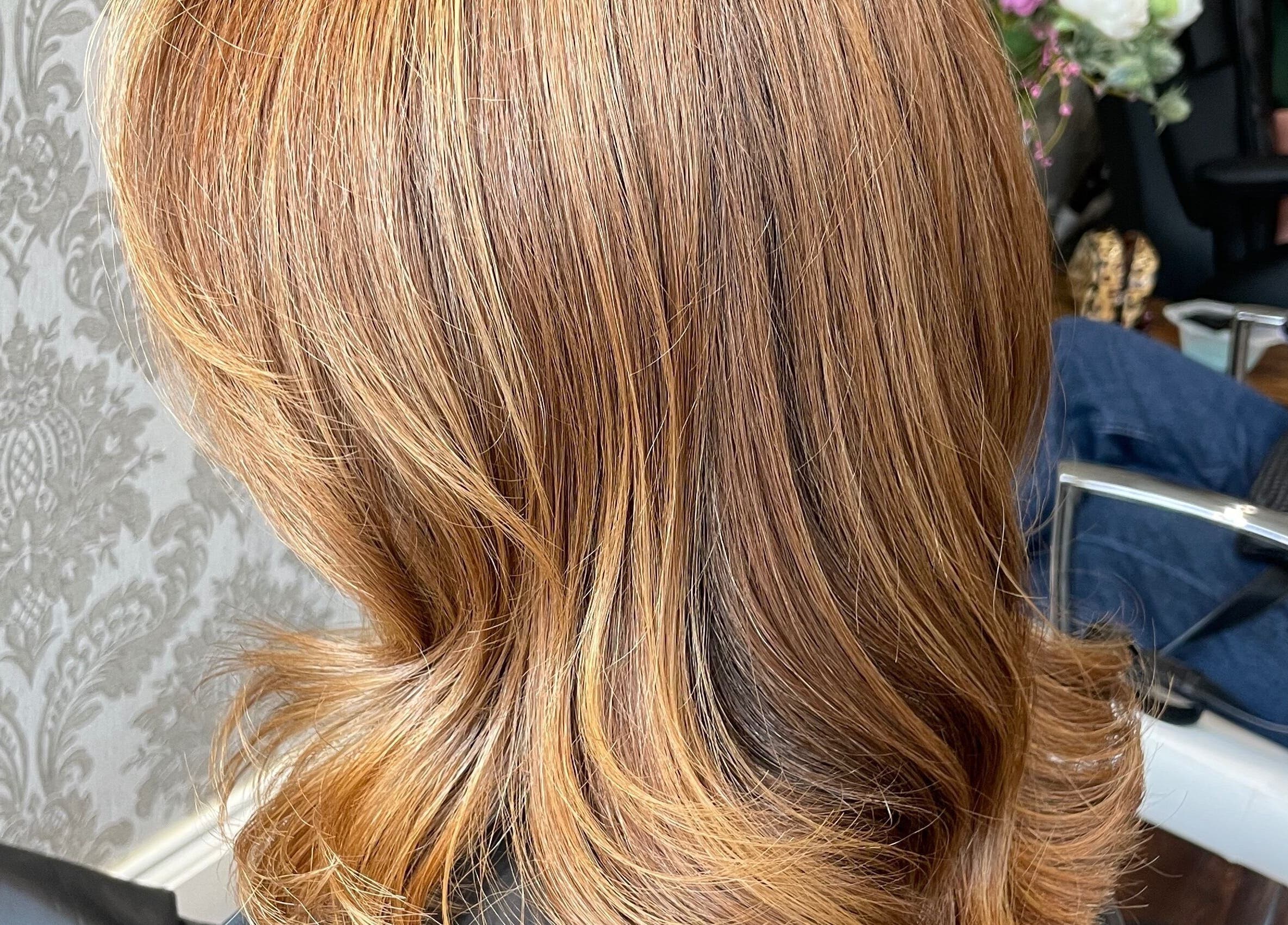 Stylish hair waves at Sophie Michelle Hair in London, England, GB with elegant wallpaper background.