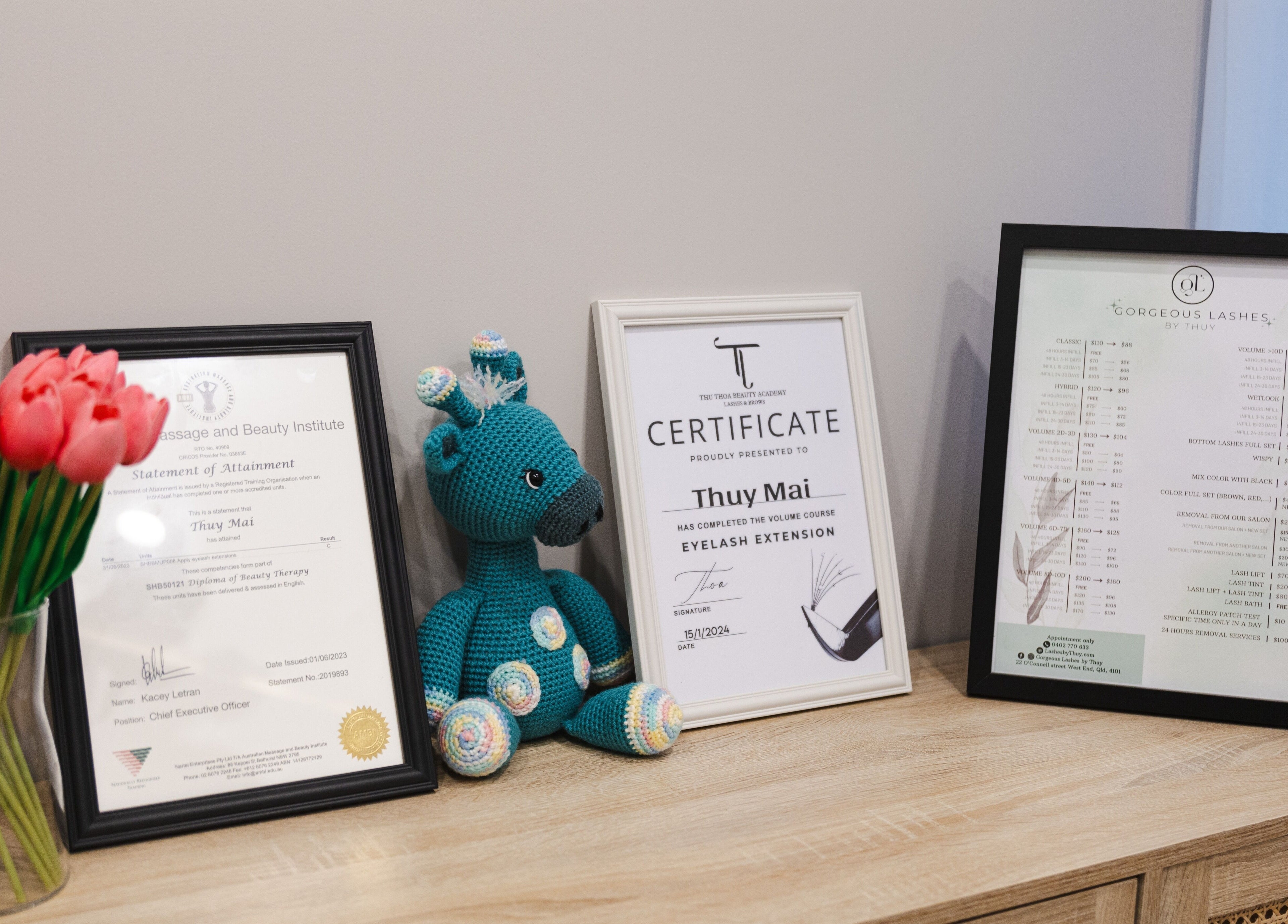 Certificates and pink tulips at GORGEOUS LASHES BY THUY, West End, Queensland, AU.