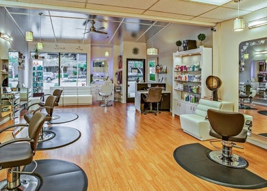 Elaris Beauty Salon interior showcasing elegant styling stations in Dubai, AE.