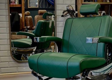 Green barber chair at Webster & Carr, Newcastle upon Tyne, England, GB.