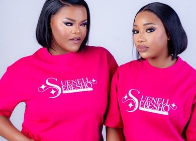 Two models in Suenell Sebesho Artistry tees, Kuruman, Northern Cape, ZA, showcasing bold beauty and style.