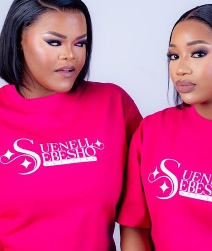 Two models in Suenell Sebesho Artistry tees, Kuruman, Northern Cape, ZA, showcasing bold beauty and style.