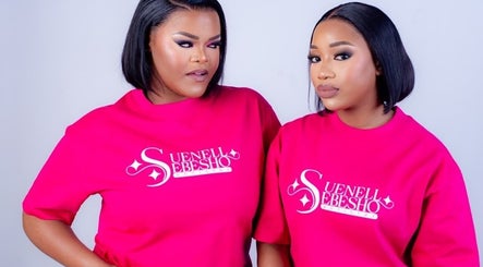 Two models in Suenell Sebesho Artistry tees, Kuruman, Northern Cape, ZA, showcasing bold beauty and style.