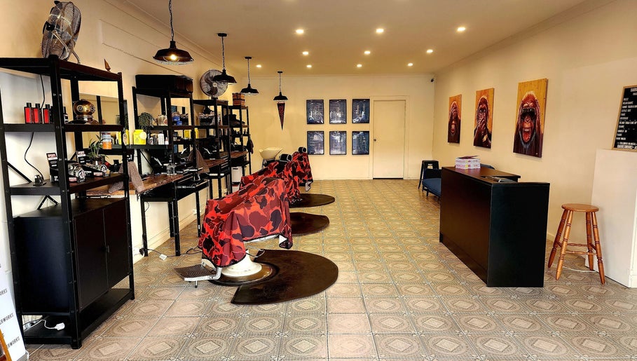 The Barberworks chic interior with vibrant chairs and art, Marrickville, New South Wales, AU.