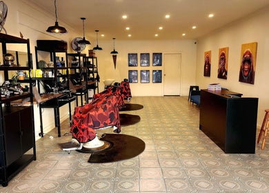 The Barberworks chic interior with vibrant chairs and art, Marrickville, New South Wales, AU.