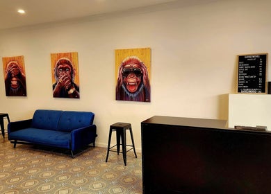 Artistic lounge at The Barberworks, Marrickville, New South Wales, AU featuring fun monkey artwork.