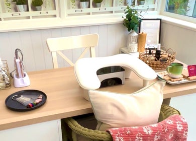 Peaceful nail station at The Nail Babe, Bromley, England, GB. Cozy chair and manicure tools displayed.