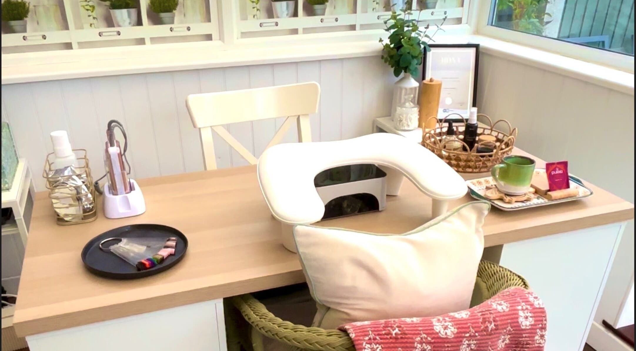 Peaceful nail station at The Nail Babe, Bromley, England, GB. Cozy chair and manicure tools displayed.