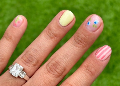 Unique manicure design at The Nail Babe in Bromley, England, GB with colorful and striped nail art.