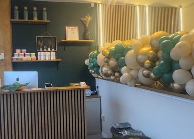 Reception area at Ily.Eyebrows Artist Pmu And Removal Specialist, Wallsend, England, decorated with colorful balloons.