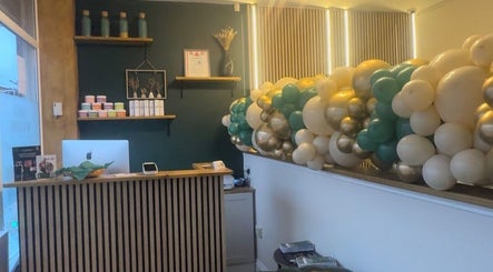 Reception area at Ily.Eyebrows Artist Pmu And Removal Specialist, Wallsend, England, decorated with colorful balloons.