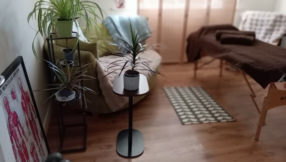 Tranquil massage room with plants at Melt Massage, Royal Leamington Spa, England, GB.