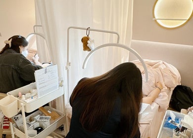 Technician applies eyelash extensions at The Lash House, Singapore, Singapore, SG.
