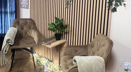 Relaxing seating area at Soul Massage Therapy, Livingston, Scotland, GB with plush chairs and calming decor.