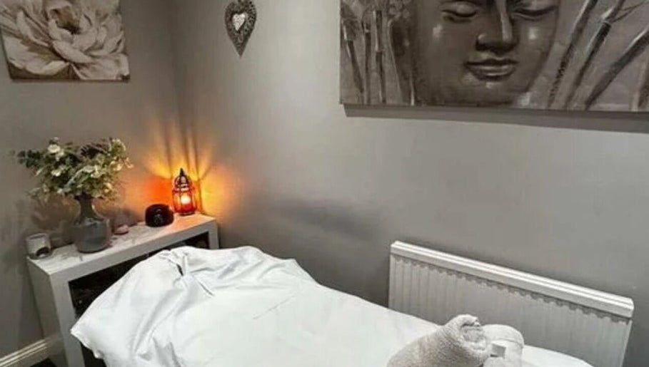 Calming massage room at Glam & Glow By Fatimah, Sale, England, GB, featuring soft lighting and tranquil decor.