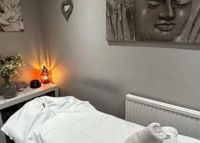 Calming massage room at Glam & Glow By Fatimah, Sale, England, GB, featuring soft lighting and tranquil decor.
