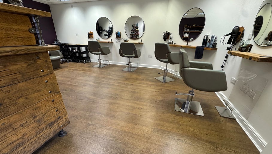 Modern salon interior with stylish chairs at Jesse Jackson Hair in Cudworth, England, GB.