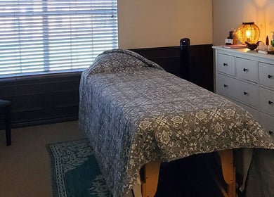 Relaxing therapy room at Active Healing Dallas in Watauga, Texas, US with a massage table and gentle lighting.