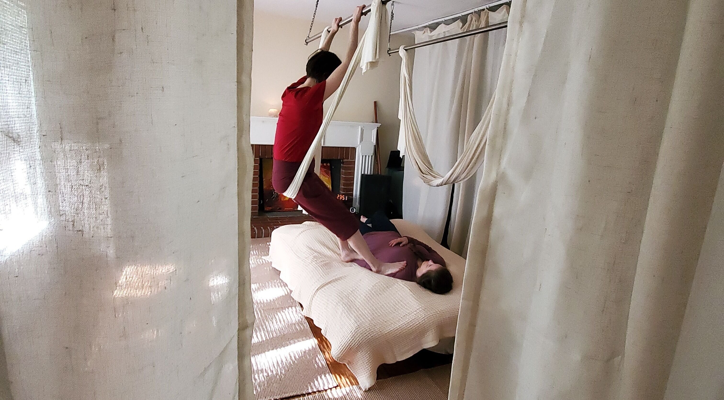 A practitioner performs aerial yoga therapy at Active Healing Dallas FT Worth in Watauga, Texas, US.