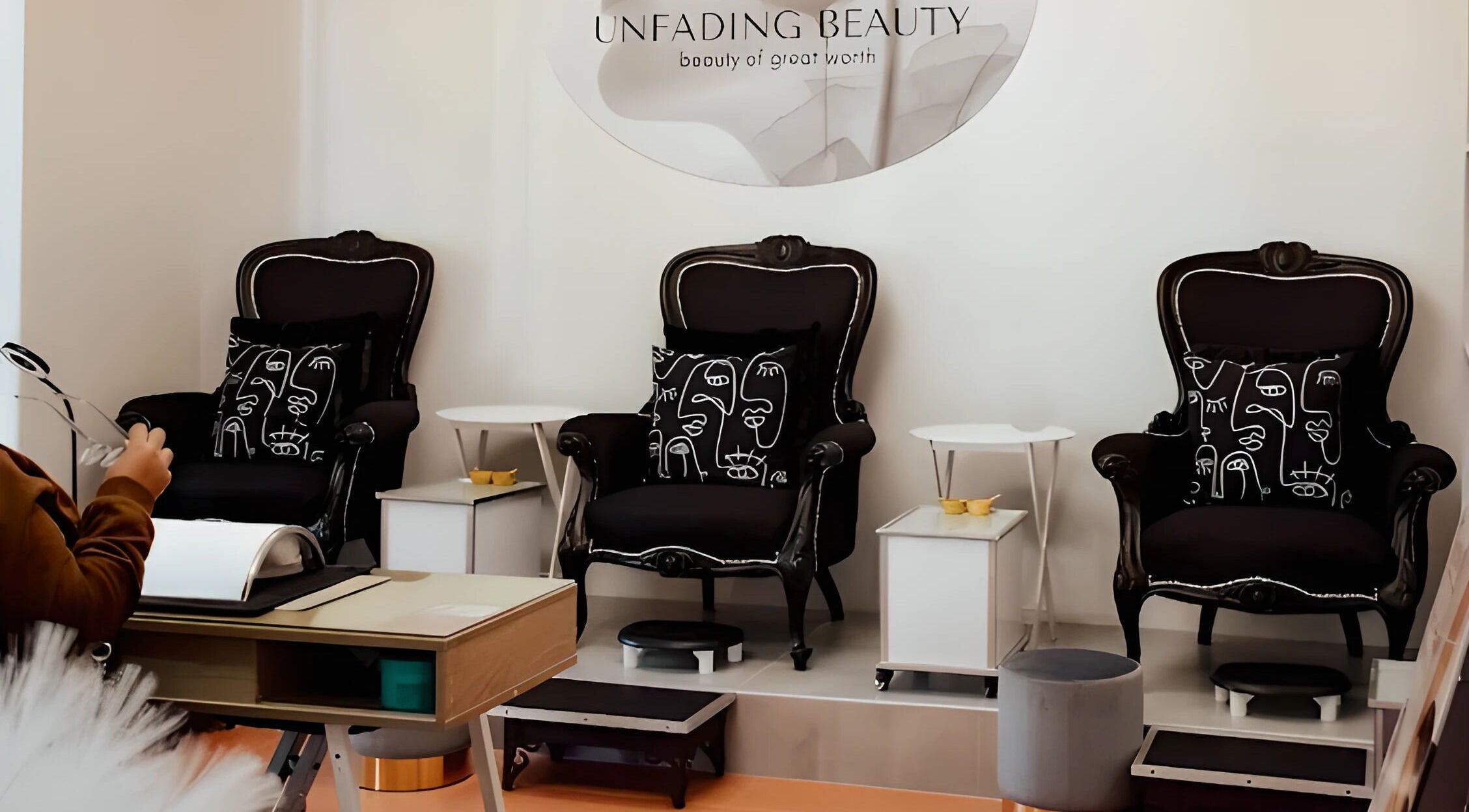 Sophisticated lounge area at Unfading Beauty, Gqeberha, Eastern Cape, ZA, showcasing elegant black armchairs.