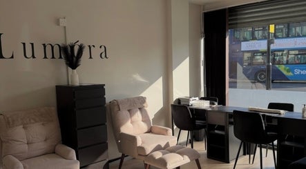 Relaxing seating area at Gigi's Skin Lab inside Lumóra, Sheffield, England, GB, with chic decor.