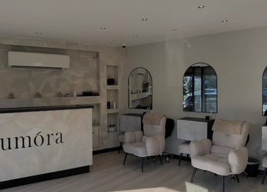 Modern interior of Gigi's Skin Lab (inside Lumóra), Sheffield, England, GB with chic chairs and a sleek reception.