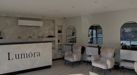 Modern interior of Gigi's Skin Lab (inside Lumóra), Sheffield, England, GB with chic chairs and a sleek reception.