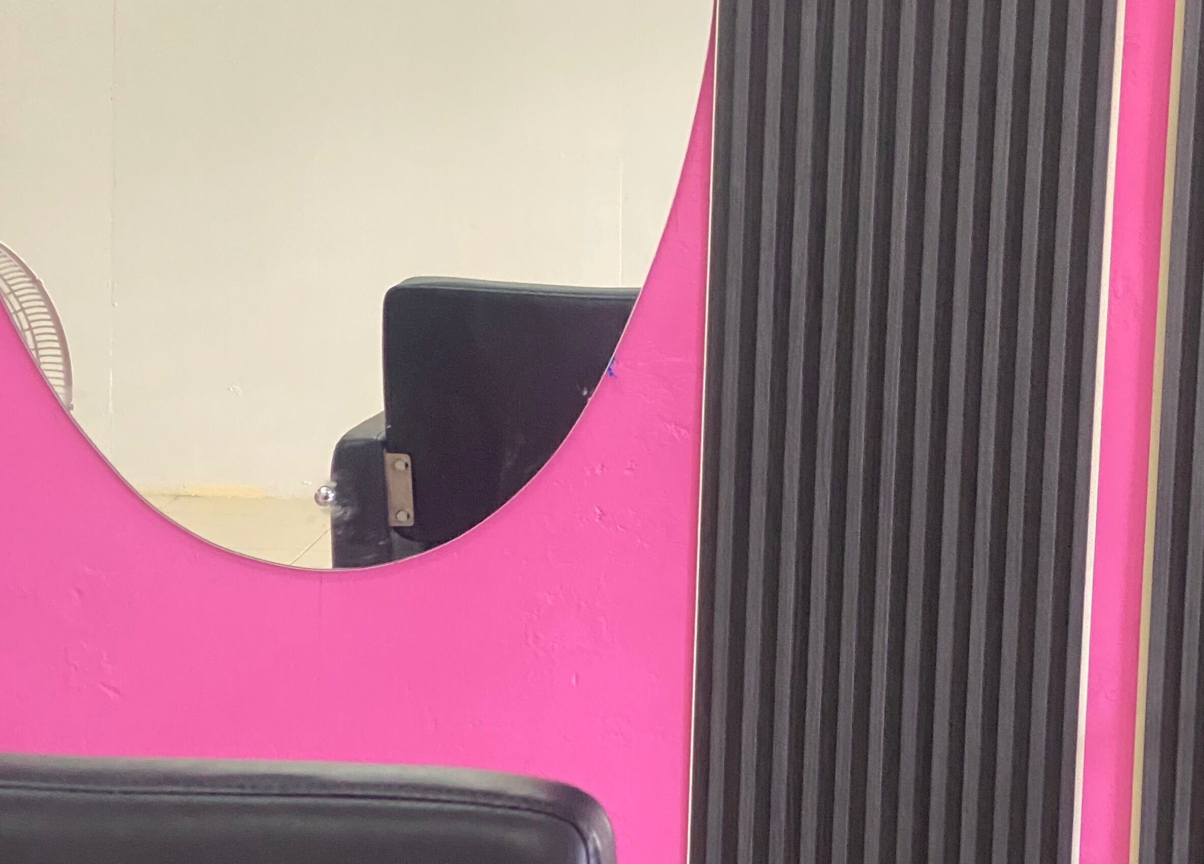 Modern salon mirror at DopexBraids, Bridgetown, Saint Michael, BB, showcasing sleek design and elegance.