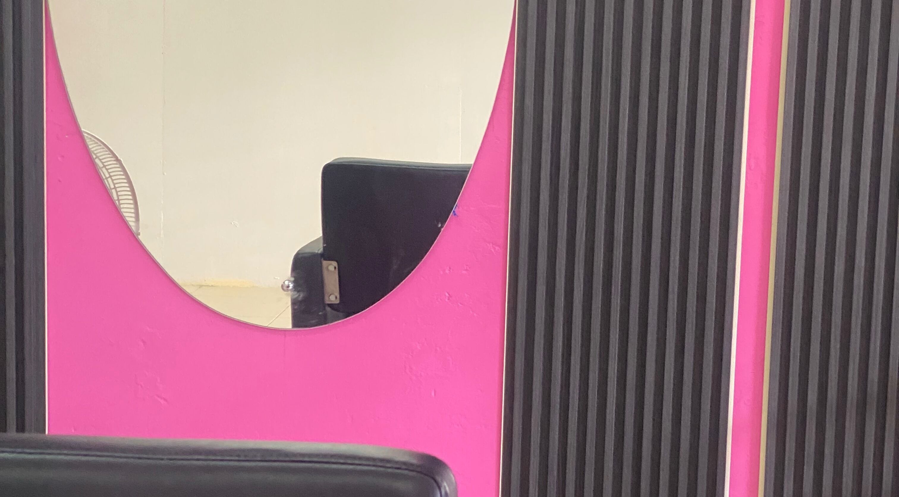 Modern salon mirror at DopexBraids, Bridgetown, Saint Michael, BB, showcasing sleek design and elegance.